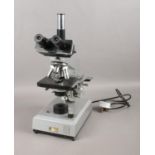 A vintage binocular microscope by Kyowa Tokyo. No 770312. Microscope light comes on.