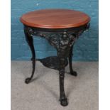 A TS Lewis cast iron tavern table with painted Britannia base.