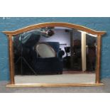 A gilt framed over mantle mirror with bevelled edge. H:78.5cm W:122cm.