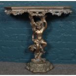 A painted cherub side table. 78cm x 78cm