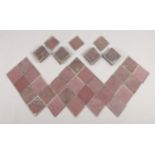 Approximately 100 Victorian pink translucent glass tiles. Some appear to have small chips.