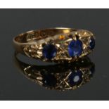 A 18ct gold blue stone & diamond ring in boat shaped setting, size N. 2.59g.