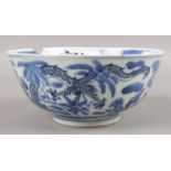 A Chinese blue & white bowl. Decorated with dragons and flowers. Bearing the Kangxi mark to the
