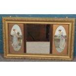 An ornate gilt framed mirror flanked by prints depicting young maidens. (62cm x 103cm)