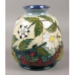 A Moorcroft vase decorated in the Strawberry plant and Butterfly pattern. Marks impressed to the