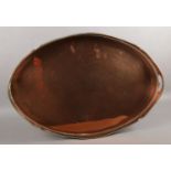 A large twin handled copper tray with gallery. Raised on four small feet.