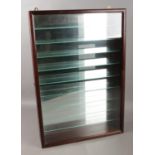 A mirror backed display wall hanging cabinet with door and glass shelves. H: 63cm, W: 43cm.
