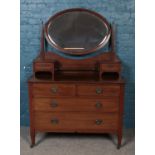 An inlaid mahogany dressing table.