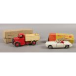 Two Dinky Toys vehicles. No. 25M Bedford end tipper truck, No 113 M. G. B sports car (boxed).