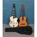 Two acoustic guitars; including España example, with Guvnor soft case.