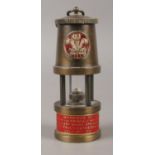 A novelty miniature miner's lamp, commemorating the marriage of HRH the Prince of Wales and Lady