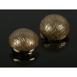 A pair of 9ct gold vintage clip on earrings with textured domes. 3.33g.