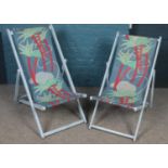 Two vintage folding deck chairs.