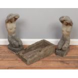 A pair of concrete garden statues formed as ladies kneeling, together with a trough. Height: 54cm.