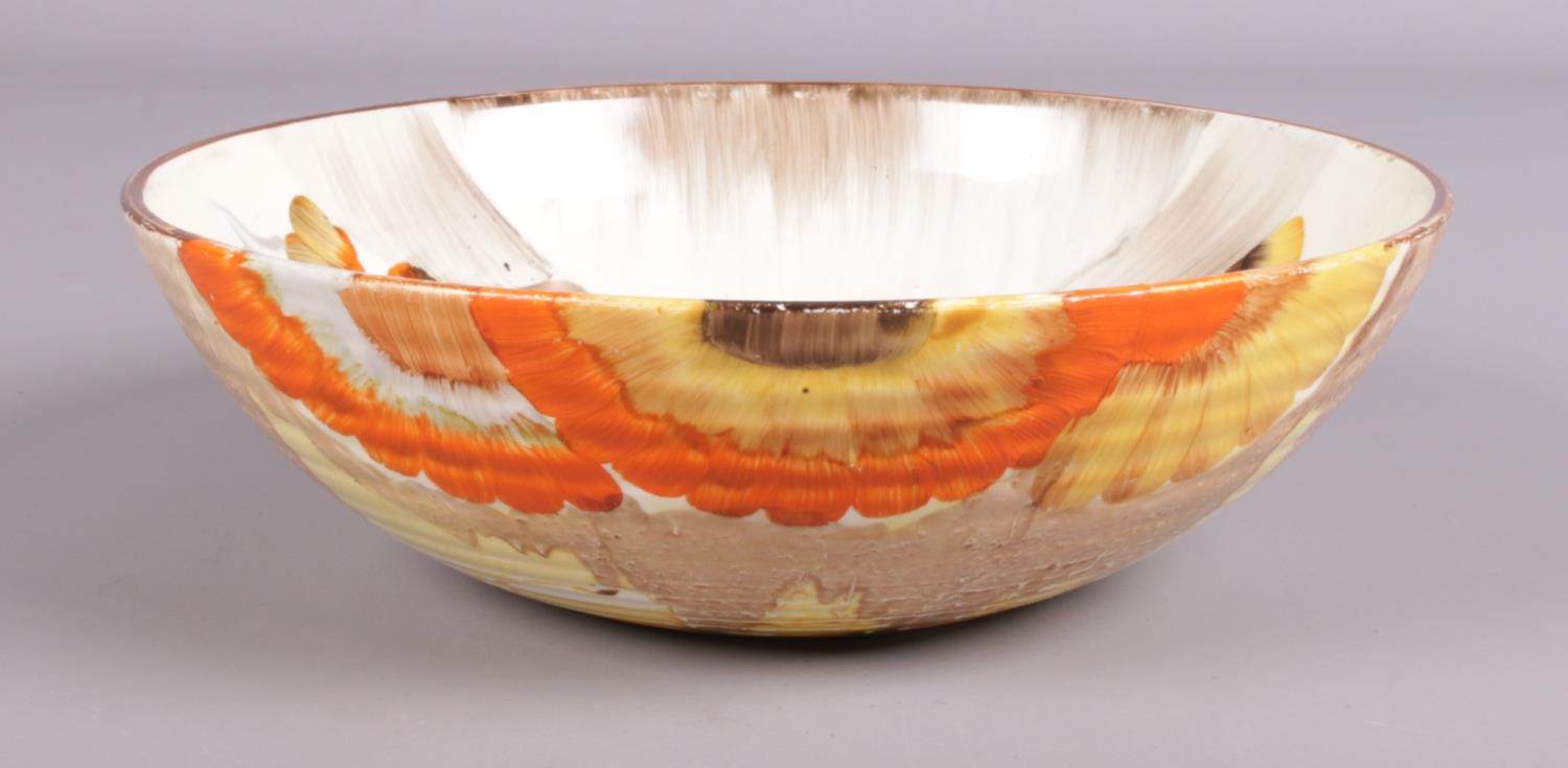 A Clarice Cliff ribbed bowl in the 'Rhodanthe' design. Marked Wilkinson LTD to base. (20cm diameter)