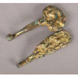 Two Chinese gilt bronze belt hooks with archaic decoration. Length of both 16cm.
