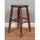 An oak stool on turned supports. (51cm height 31cm width)