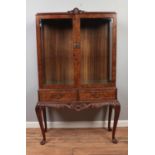 A Queen Anne style burr walnut display cabinet. Height 159cm, Width 99cm, Depth 41cm.