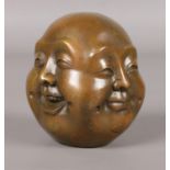 An oriental bronze four face Buddha, showing happiness, sadness, joy and anger. Seal mark to base.