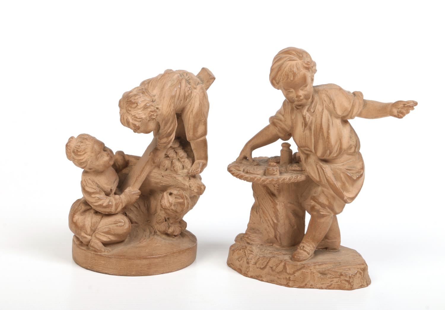 A pair of late 19th century French small terracotta sculptures. One of a young boy posing as a - Image 2 of 4