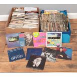 Two boxes of 45 rpm vinyl records. Billy Idol, Pretenders, Elton John, Erasure etc
