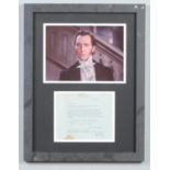 A framed Peter Cushing display. With original letter from the Horror genre actor to a fan, dated