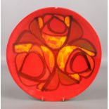 A Poole Pottery Delphis shallow bowl on red ground, shape mark 4. Diameter: 26.5cm. Hairline crack