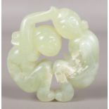 A Chinese jade carving formed as a man and woman. 5.5cm diameter.