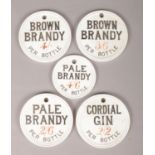Five 19th century pottery spirit labels for Cordial Gin, Brown Brandy and Pale Brandy.