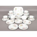 A Twenty-one piece Shelley tea service, in the Wild Flowers pattern. Includes six teacups, saucers