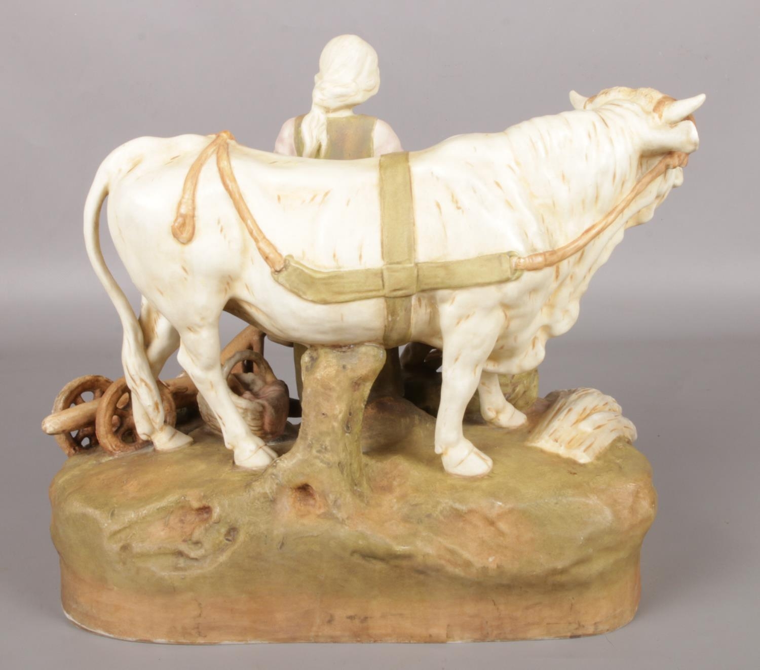 A Royal Dux figure group modelled as a farming couple and a cow. 29cm. Good condition. - Image 2 of 3
