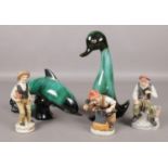 Five ceramic figures, to include two in the style of Poole, formed as a dolphin and a duck.