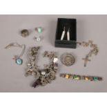 A quantity of mostly silver jewellery. Including charm bracelet some silver charms, silver medal,