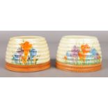 Two Newport Pottery Clarice Cliff beehive honey pots in the Autumn Crocus design. Both lacking