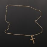 A 9ct gold cross pendant on chain. 2.26g. 55cm.
