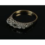 An 18ct gold & platinum diamond ring. Size P. 2.87g. Missing centre diamond stone.