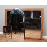 Three mirrors. To include a tulip design mirror and an arch shaped wall mirror. Largest: H: 135cm W: