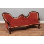 A child's carved mahogany sofa. Height 47cm, Width 113cm, Depth 45cm.