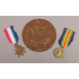 A First World War medal pair, along with a bronze death plaque, all relating to Private John