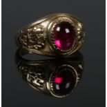 A 9ct gold signet ring with red cabochon stone. Size K. 5.07g.