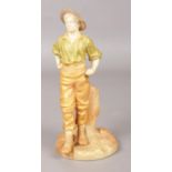 A Worcester blush figure modelled as a man in a hat. 17cm. Arm repaired. Missing section of
