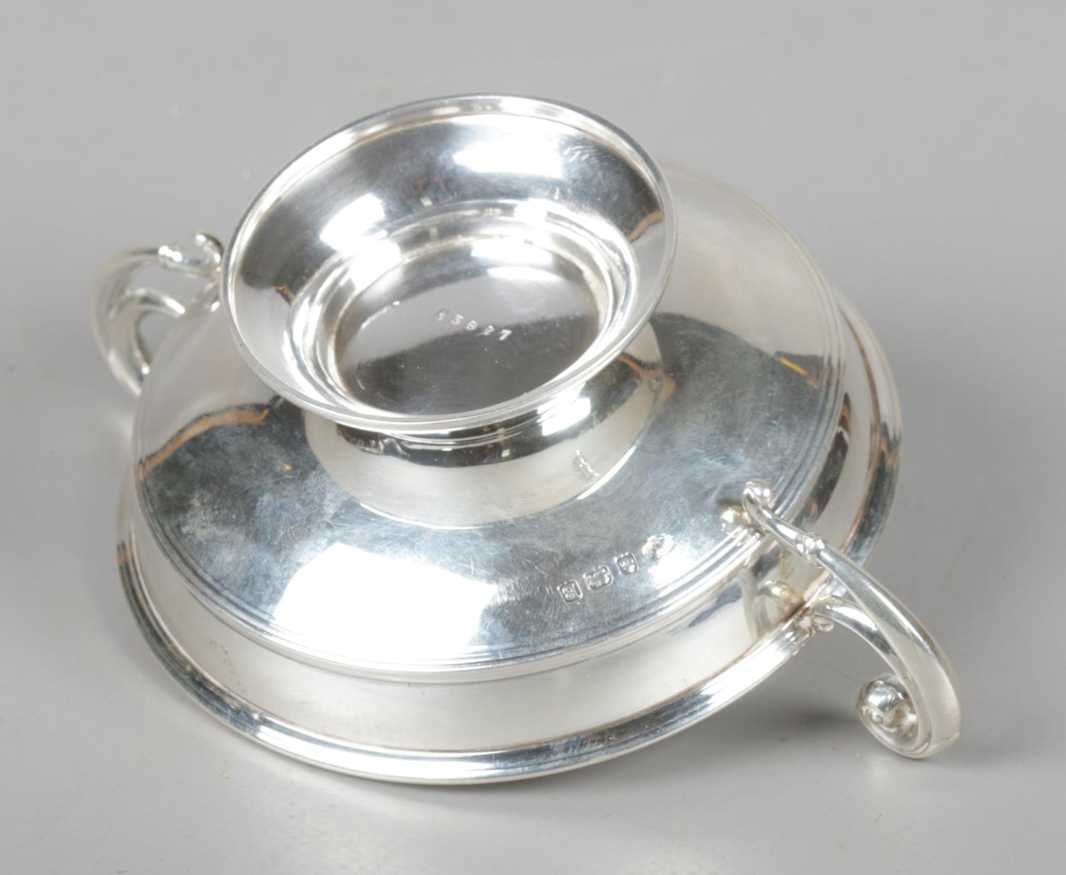 A George V silver twin handled dish. Assayed Birmingham 1926 by William Hutton & Sons Ltd. 90g. - Image 2 of 2