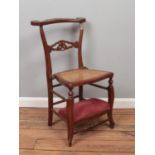 A mahogany prayer chair with bergere seat. Signs of woodworm.