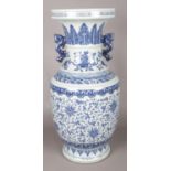 A large Chinese painted porcelain heaped & piled blue & white baluster floor vase, decorated with