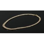 A 9ct yellow gold graduated Byzantine necklace by Shipton & Co. 42cm. 16.8g.