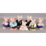 Seven Wade pottery Natwest pigs.