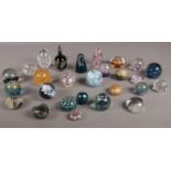 A collection of mostly glass paperweights. To include Caithness, Selkirk, Robert Held art glass.