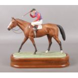 A Royal Worcester horse racing figure, titled The Winner, modelled by Doris Lindner. Dated 1959.