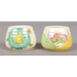 Two small Clarice Cliff honey pots in the Aurea and Honeydew designs. Height 3.5cm. Both lacking