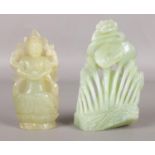 A Chinese jade figure of Guanyin along with another carved jade figure. Height of Guanyin 13.5cm.